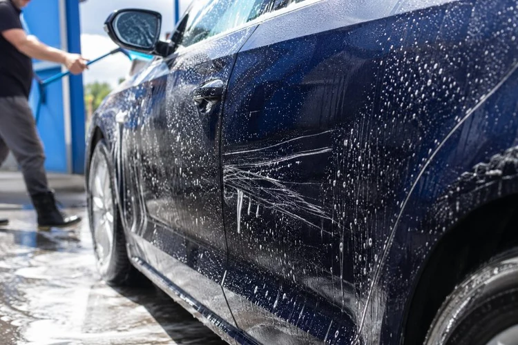 Clean the car surface with water and soap